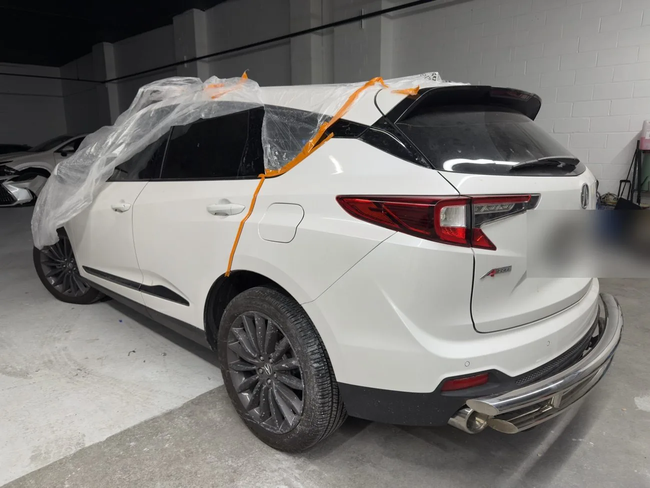 Acura RDX rear quarter panel repaired and refinished after collision repair at Exclusive Collision & Repair auto body shop in Brooklyn, NY