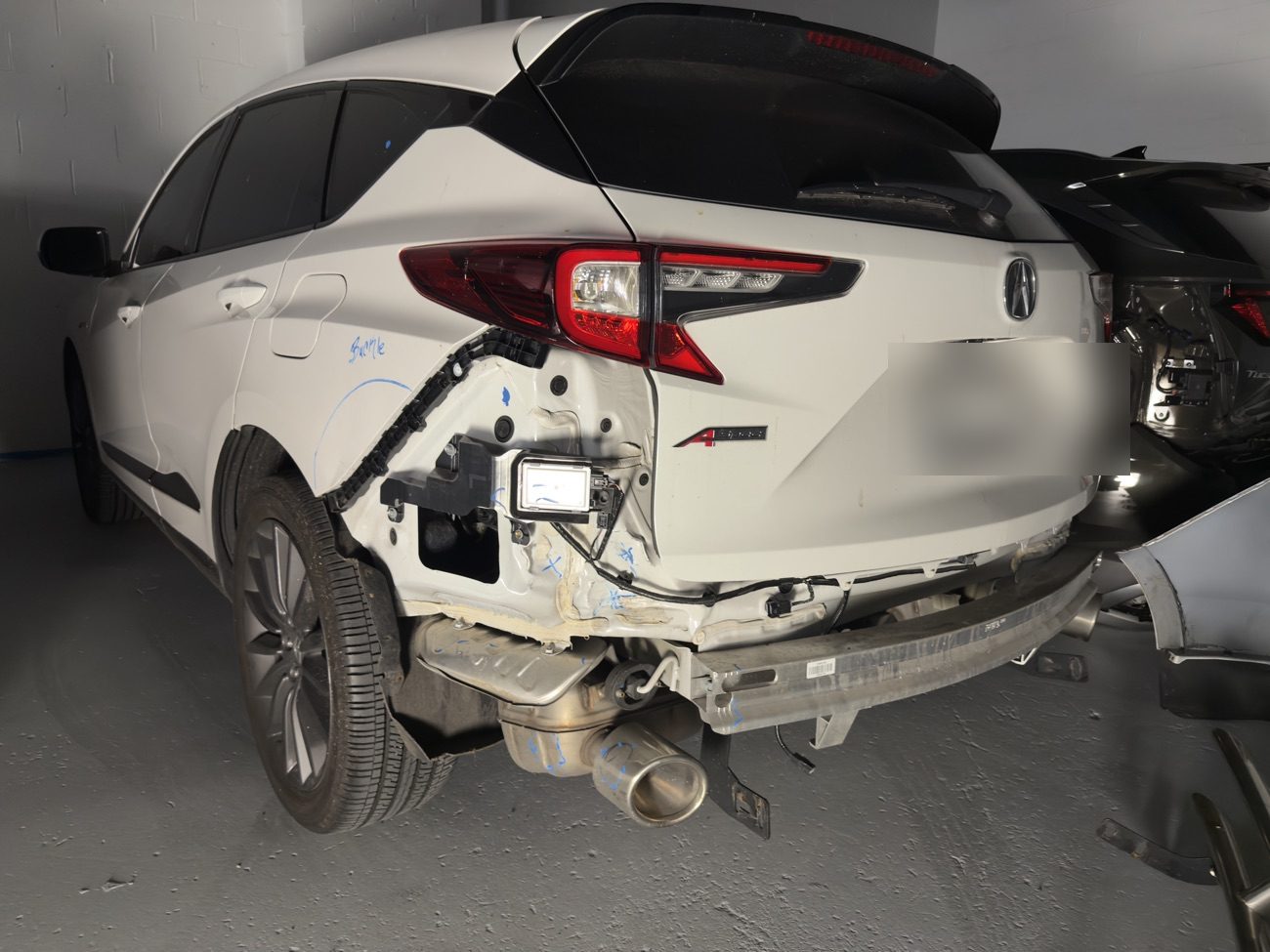 Acura RDX with rear bumper collision damage before auto body repair at Exclusive Collision & Repair in Brooklyn, NY