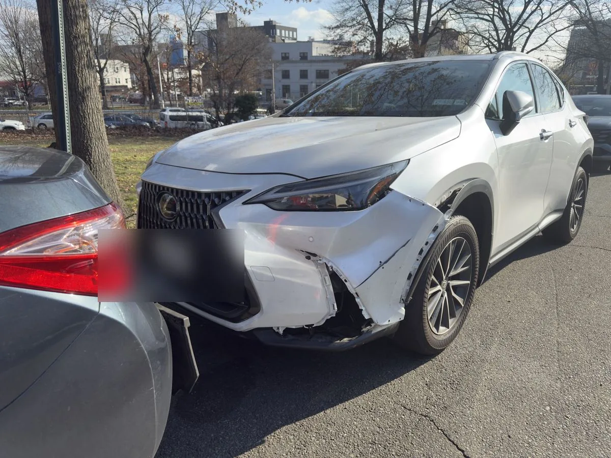 Lexus NX with front-end collision damage before collision repair at Exclusive Collision & Repair in Brooklyn, NY
