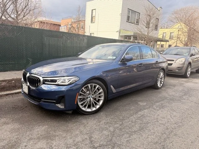 Blue BMW 5 Series finished and restored to pre-accident condition after collision repair at Exclusive Collision & Repair, an auto body shop in Brooklyn, NY