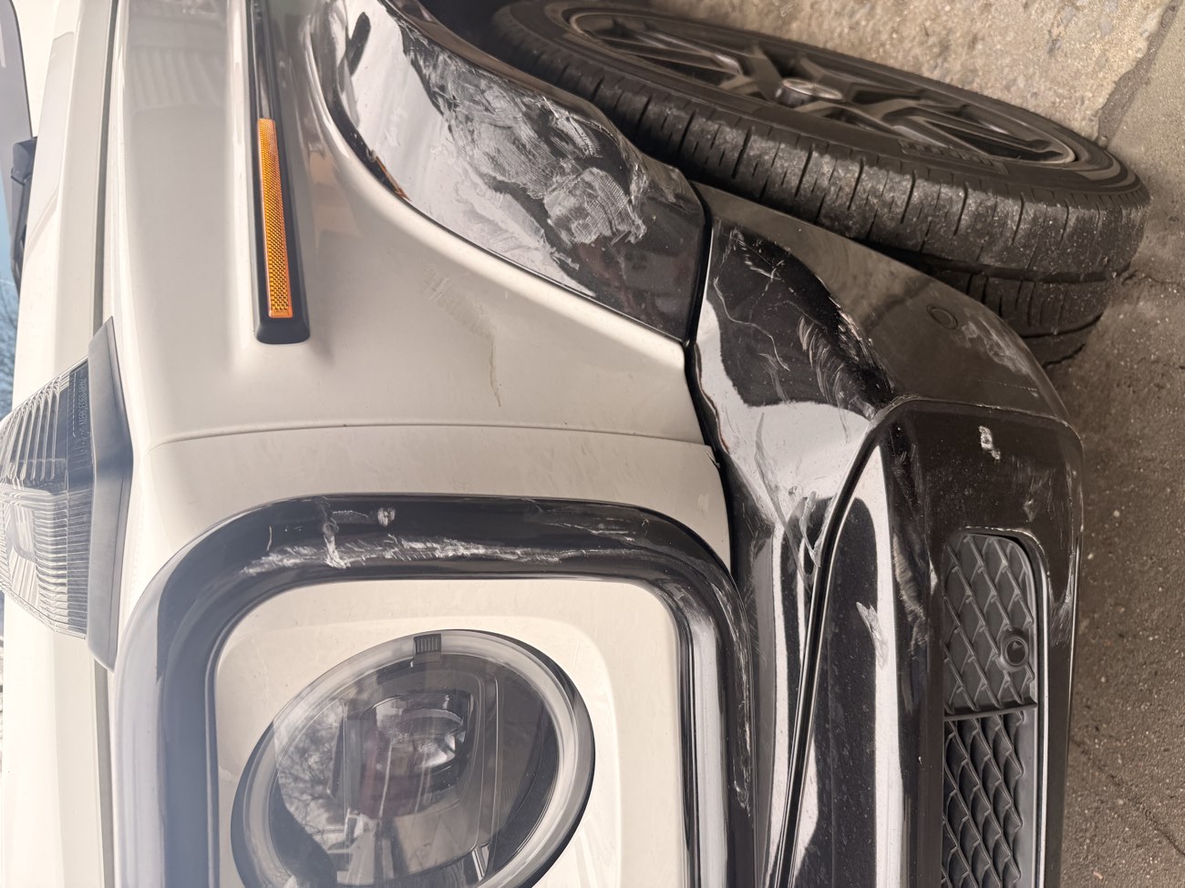 Mercedes G-Wagon with scraped fender and bumper collision damage in Brooklyn, NY before towing to Exclusive Collision & Repair